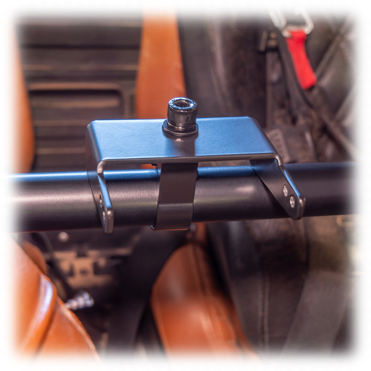 Black powder-coated universal air pumper bracket on roll cage bar