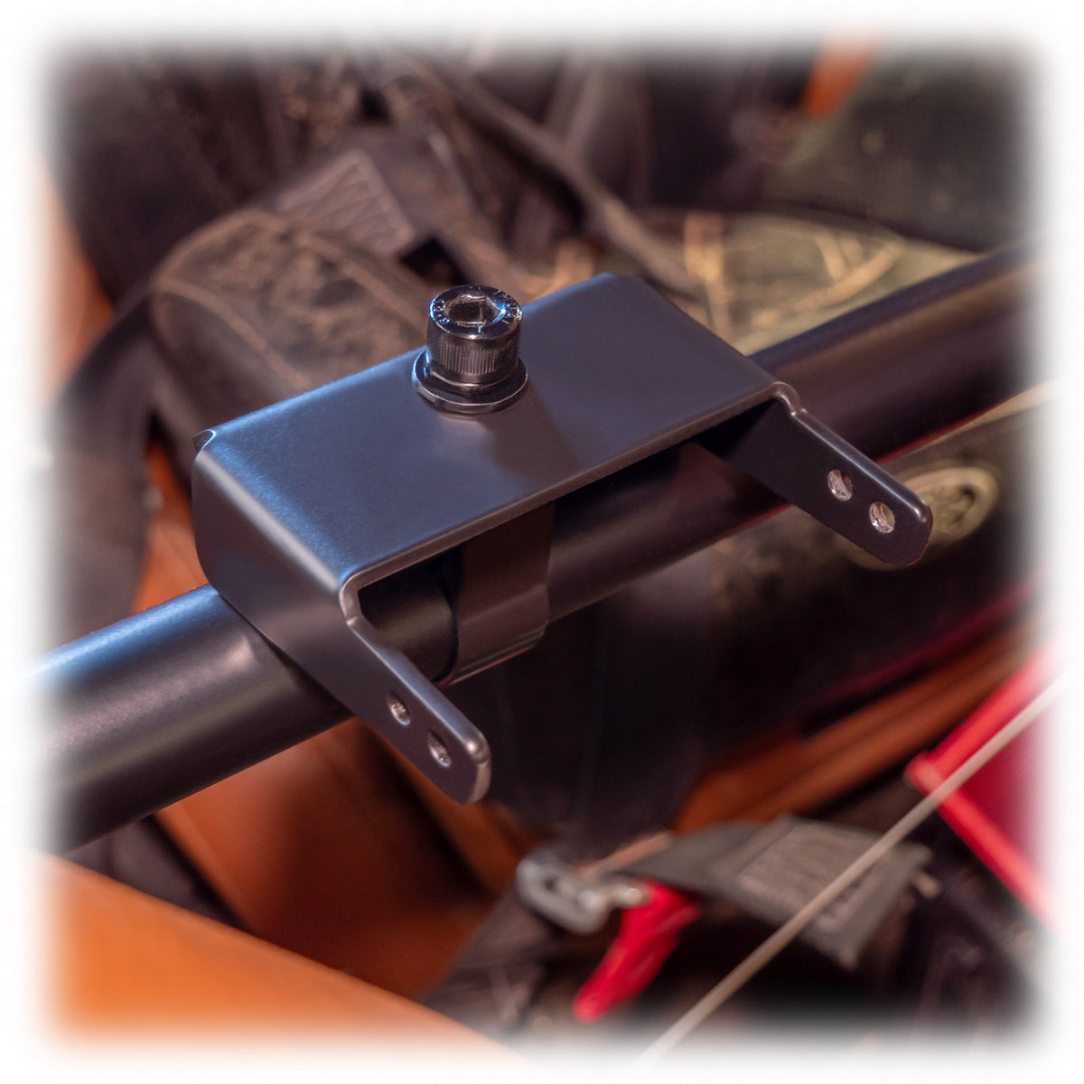 Black powder-coated universal air pumper bracket on roll cage bar