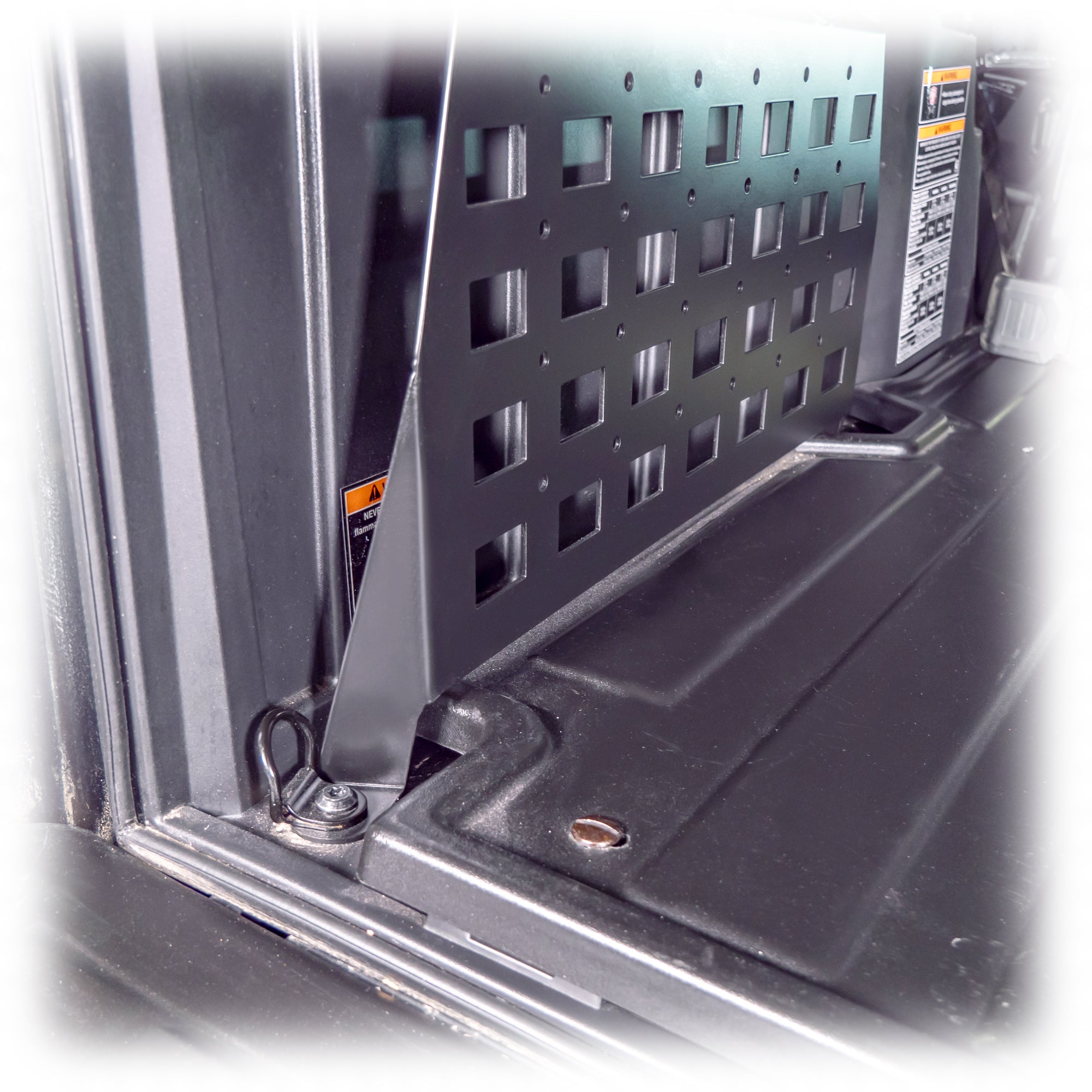 Installed cargo molle panels on an adventure UTV