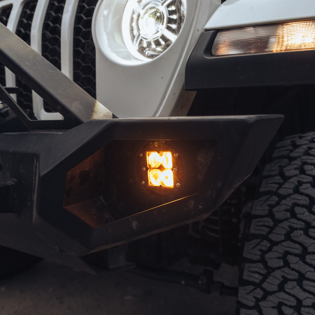amber led fog light kit mounted on a jeep