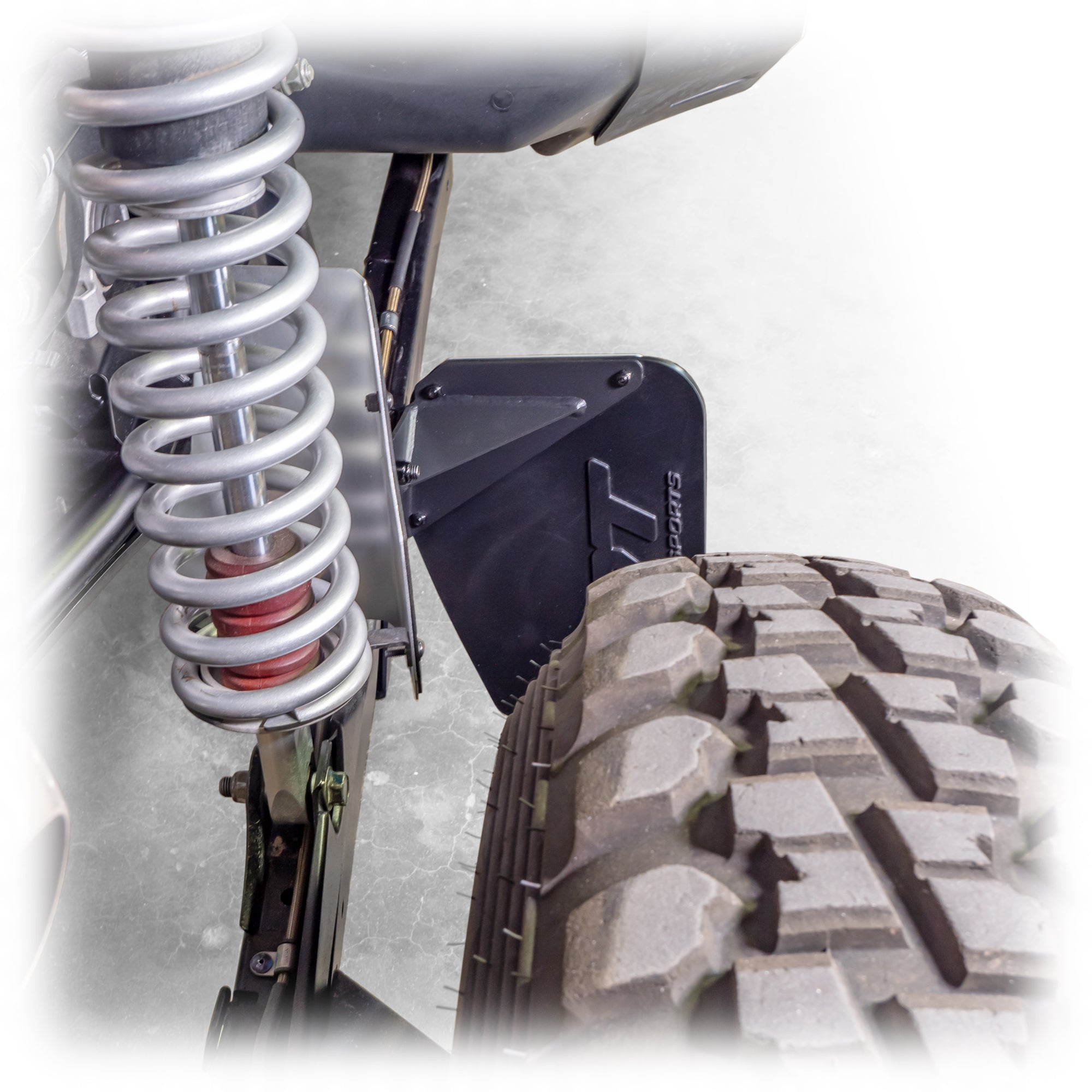 Polaris RZR Pro XP billet aluminum rock guard installed view rear suspension